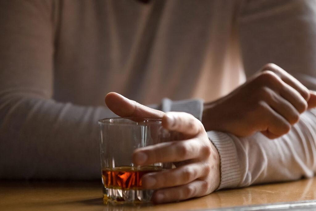 individual showing signs of alcohol addiction