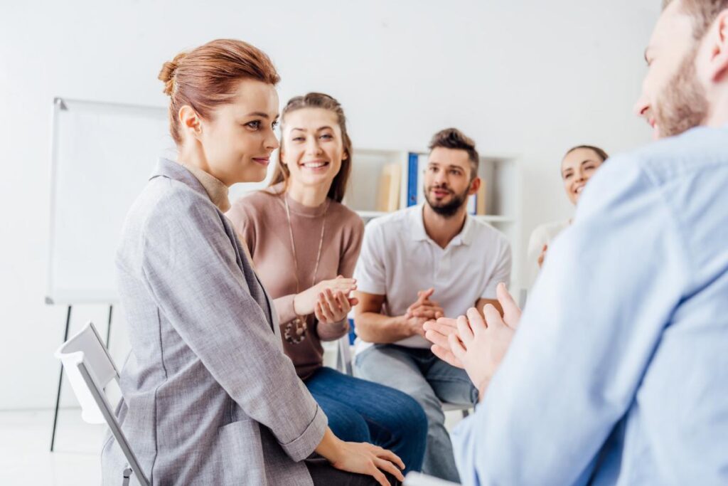 a group of people engage in a therapy group at mental health facilities in delaware