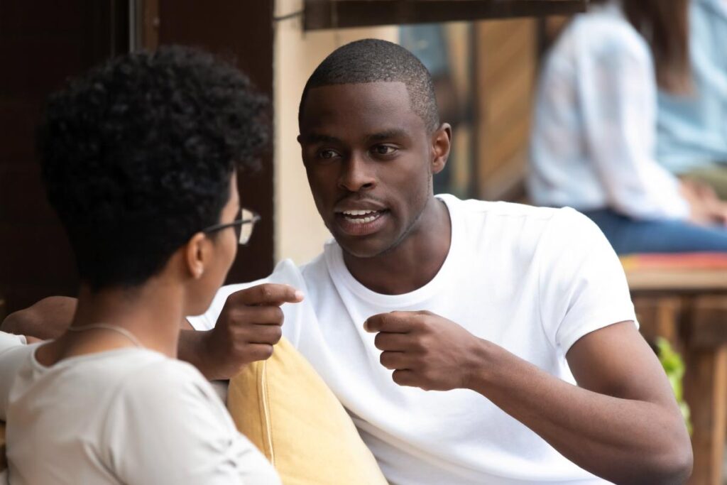 man and woman discussing benefits of xanax addiction treatment program